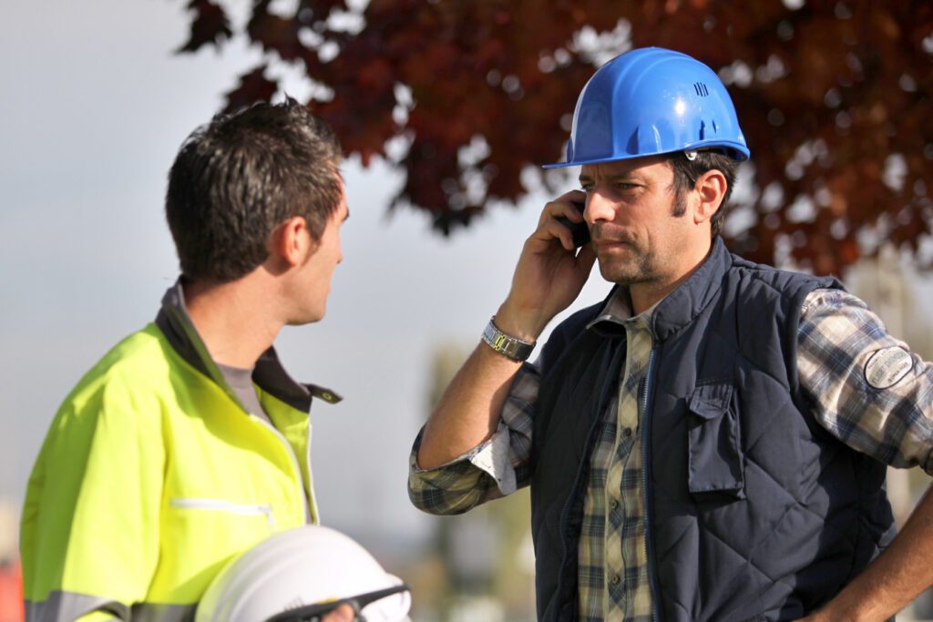 Construction worker on phone