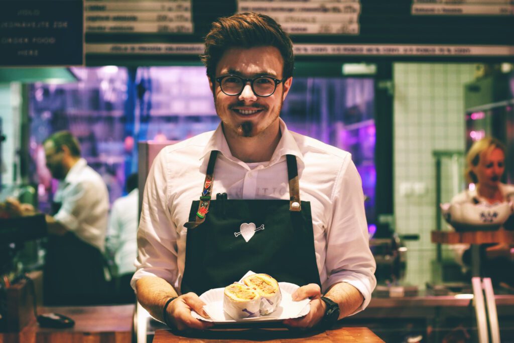 Restaurant server holding food