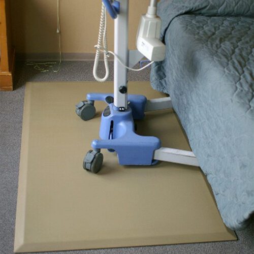 Healthcare equipment on top of a SmartCells mat next to a bed