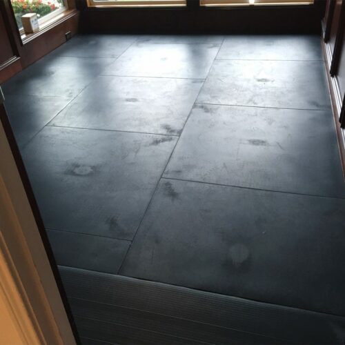 SmartCells Fall protection flooring installed as an underlayment with carpet over top