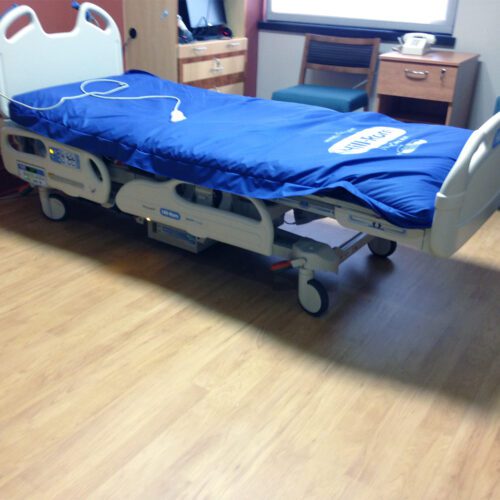 Hospital bed sitting on top of SmartCells flooring