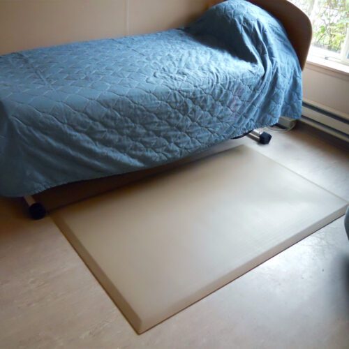SmartCells bedside mat sitting next to bed