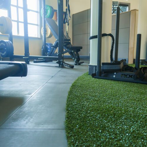 Gym equipment sitting on top of SmartCells flooring located in Physical Therapy setting