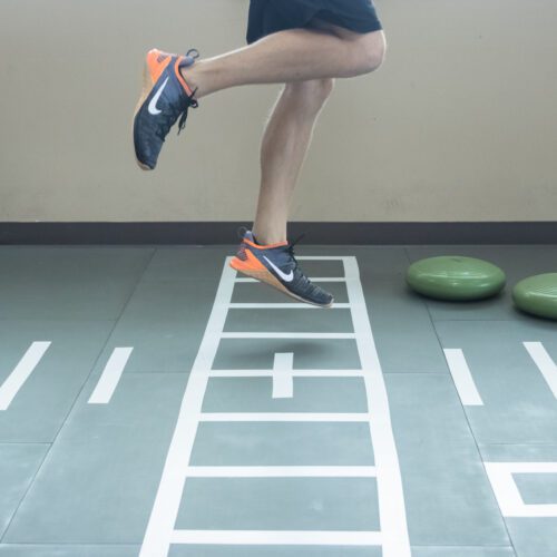 Patient doing rehab exercises on SmartCells Physical Therapy mat