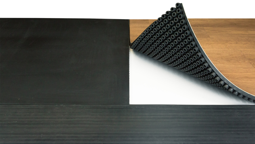 Bottom of SmartCells flooring tile being shown in fall protection configuration
