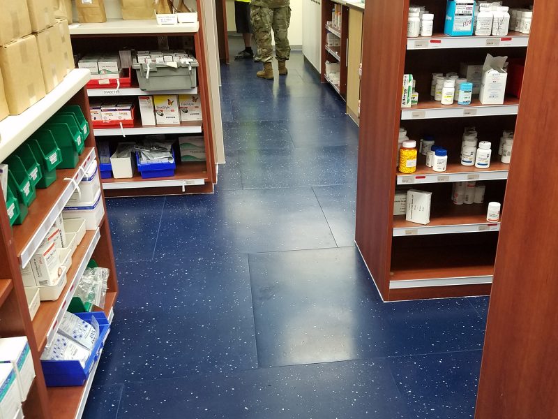 Military employee standing on blue Smartcells pharmacy flooring