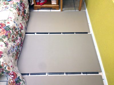 Pieces of a SmartCells Fall Protection product laid on the floor in a bedroom