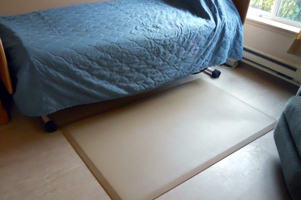 SmartCells bedside mat sitting next to bed