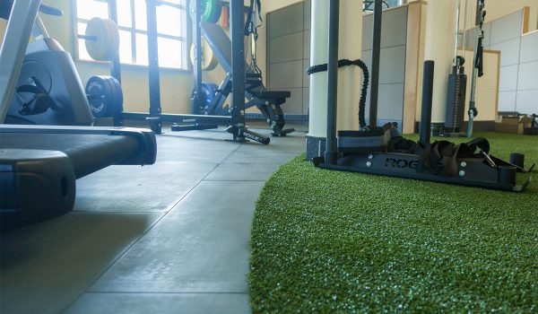 Gym equipment sitting on top of SmartCells flooring located in Physical Therapy setting
